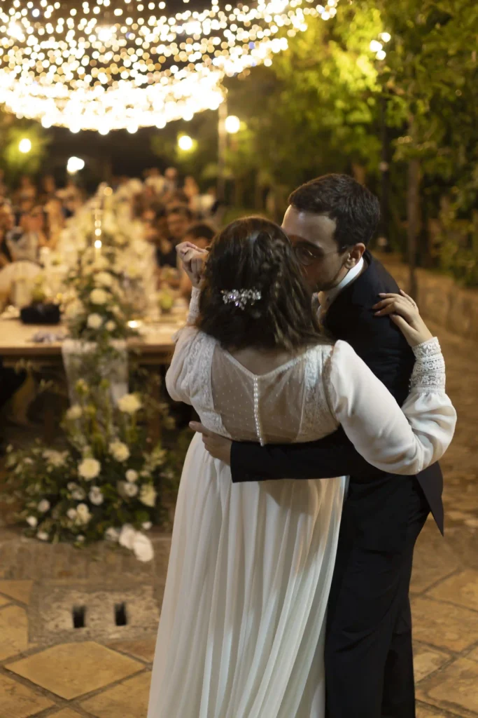 Romantic first dance under fairy lights at an Italian wedding, captured by local wedding photographer Anna O Brambilla